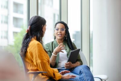 A mental health professional speaks with a client during a counseling session.